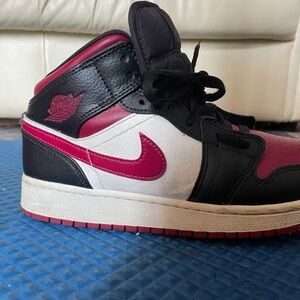 Nike Air Jordan Black, Red, and White High Tops